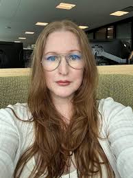 Hi! Could you please fix the background (remove cars and make it green) fix  my arms to look thinner, close my mouth a bit, and fix the hair giving me a  middle