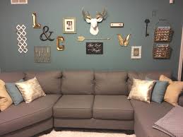Rose gold pendant lights adds a touch of luxury to the bar counter. Teal Gold Grey White Living Room Wall Collage With Deer Living Room Decor Gray Teal Living Room Decor Living Room Grey
