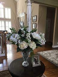 Foyer Silk Flower Arrangement In A Tall Crystal Vase Hydrangeas And Magnolias Framed Pi Crystal Vase Decor Flower Vases Decoration Flower Vase Arrangements