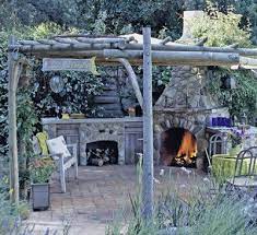 Check out these 30+ best outdoor kitchen ideas on a budget. Rustic Space A Rustic Pergola Gives Structure To This Kitchen Area That Is Centered Around A Stone Firep Rustic Outdoor Kitchens Rustic Outdoor Rustic Pergola