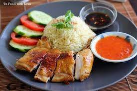 Hainanese Chicken Rice Makes A Regular Appearance On Our Dinner Table Almost Every Sunday Evening We Chicken Rice Recipes Chicken Rice Roast Chicken And Rice