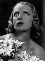 Tamara De Lempicka with lillies. c. 1934 Photo by Mario Camuzzi.