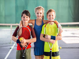 Boy with tennis racket in studio. 10 Best Tennis Racquets For Kids Junior Players 2021 Buyer Guide