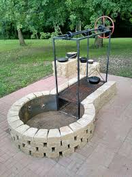 In an aboveground brick fire pit, the bricks function more as a fire ring, containing burning logs. Brick Fire Pit Bbq Novocom Top