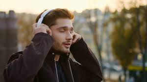 Anime boy headphones listening music hat anime guys anime. Portrait Emotional Hipster Guy Listening Music Via Headphones Outdoors Closeup Excited Man Enjoying Favorite Song Through Earphones Outside Happy Male Person Singing During Walk On City Street Stock Video Footage Storyblocks