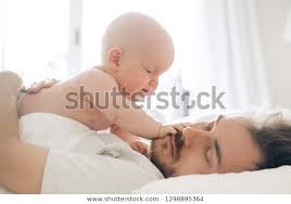 Father Son Bed Morning Baby Waking Stock Photo Edit Now 1298895364