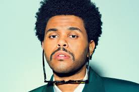 The weeknd adds doja cat to the remix of in your eyes as the two singers pair well together on the after hours single. The Weeknd Is Rocking Around The Christmas Tree For Smiley Selfie Billboard