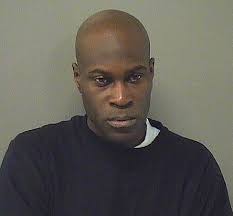 Man allegedly vandalizes vehicles at auto shop, hits owner with rock