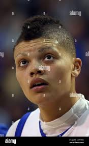 Former NFL player Randy Moss, right, poses with a bust of himself and  presenter, son Thaddeus Moss, during an induction ceremony at the Pro  Football Hall of Fame, Saturday, Aug. 4, 2018