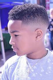 The curly mohawk, one of the coolest black boys' haircuts that combine the appeal of a thick curly top with faded sides. Pin On Smart Hairstyles
