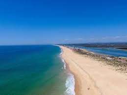 Praia de faro beach is a city beach that is bustling and full to the brim with excitement! Praia De Faro The Complete Guide