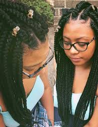 Separate the top section of hair at the temples, twist into a bun and secure with a single pony holder. 20 Funky Fresh Styling Ideas For Jumbo Box Braids