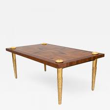 Featuring a refined marquetry top and brushed brass base, this elegant coffee table is the perfect fusion of classic craftsmanship and modern design. Marquetry Coffee Table With Gilt Wood Screw Legs