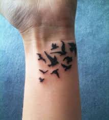 Image Result For Small Black Dove Flying Tattoos On Front Shoulder Bicep Wrist Tattoos For Guys Cool Wrist Tattoos Tattoos For Guys