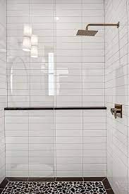 For a superior install, we used a in this video i show you how to install and grout a 4x16 subway tile on a kitchen backsplash and run it this video shares tips for how to tile a shower wall using subway tile. Shower Tile 4x16 White Subway Tile In A Horizontal Stack Pattern And River Rock For Shower White Subway Tile Shower Bathroom Shower Tile Bathroom Shower Design