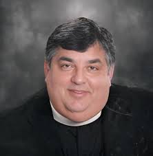 Canon Ernest Saik Obituary