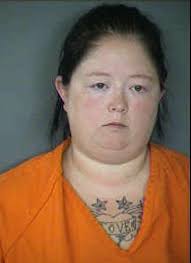 Woman accused of videoing assaults