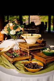 Whether you're throwing a southern summer soiree or an elegant wedding, these ideas will help you manage the food service and the flow of your guest experience Elevated Buffet Table Displays Ideas Round Table Lunch Buffet Decorating Ideas Vertical Arrangement Food Buffet Decor Buffet Table Decor Lunch Buffet