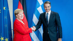 Merkel herself said the gesture arose as a pragmatic solution to the problem of what to do with one's hands in pu. German Paper Claims Angela Merkel Staved Off Greek Turkish Military Clash Neos Kosmos