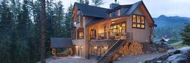 Post and beam construction uses glulam beams or natural timber placed on vertical posts to create expansive living spaces. Timber Frame Homes Riverbend Custom Timber Homes