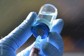 Drawing Medication From Blue Vial Stock Photo | Adobe Stock