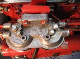 Lehman Sp135 Fp6089149 Dual Fuel Filter Assembly With Bleed Screws Off Center And The Centered Bolts That Hold The Element And Heat Exchanger Bowl Hold On