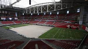 The hot summer days are brutal for players and fans, so the roof was a celebrated feature. Grass Field Rolls In At University Of Phoenix Stadium