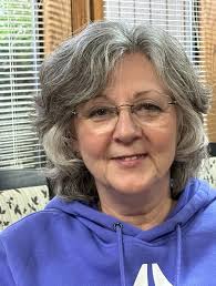 Willie Wiredhand, national mascot for Rural Electric Cooperatives, joins  (left to right) Kelsie Wilson, Erin Hill, Alyssa Smiley, and Sarah Wilhelm,  along with the dolls Northeast Oklahoma Electric Cooperative are sponsoring  "fostering"