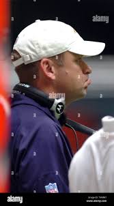 St. Louis Rams coach Scott Linehan, left, poses with the team's first-round  pick in the NFL football draft, Tye Hill, center, from Clemson, with Hill's  mother, Glennie, second from right, and father,