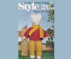 He has yellow checked trousers and scarf, knitted red jumper and white laced shoes his face has appealing black eyes and hand embroidered mouth and nose. Pin On Doll Toy Patterns 1970 S 2000 S