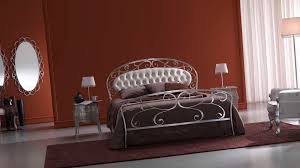 Can you hear a harpsichord providing some romantic background this wrought iron canopy bed is shown with an exquisite wrought iron chandelier. Fantastically Hot Wrought Iron Bedroom Furniture