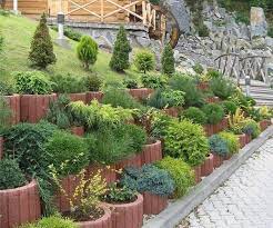 Whether you're building a retaining wall or just need some extra privacy, a cinder block wall is an affordable way to get the job done. Rustic Exterior Retaining Wall Ideas Cinder Block Sloped Garden Garden Retaining Wall Cinder Block Garden Wall