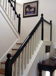 White Entryway With Stairway With Black Banister Black Banister Staircase Design Black Stair Railing