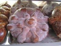 Pan De Muerto Or Bread Of The Dead Is A Sweet Anise Scented Bread Served During Mexico S Dias De Los Muer Pan De Muerto Mexican Food Recipes Mizeria Recipe