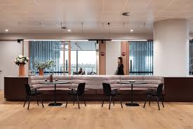 Silver and wood ceiling fan with a light on a white ceiling. Sas 150