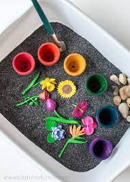 Show your toddler how to pick things up with a pair of tongs. 12 Fun Plant And Seed Learning Activities For Kids
