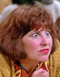 Sherry Becker in orange dress from Seinfeld