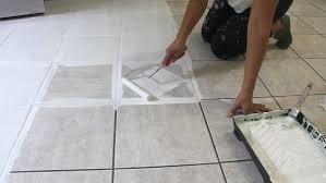 How To Stencil A Tile Floor The Secret Is Out Tile Floor Painting Tile Floors Stenciled Tile Floor