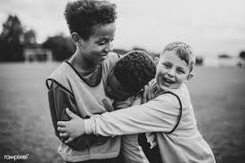 Black And White Kids Hugging Each Other Download Premium Image Of Junior Football Team Hugging Each Other 529066 Football Team Female Football Player Football Boys