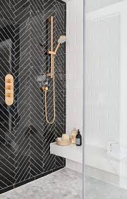 Black And Gold Tiles Uk Black Herringbone Tile Feature Wall In Shower Patterned Bathroom Tiles Gold Fixtures Bathroom Tile Designs