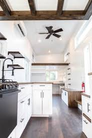 The walls, island, cabinets, and chairs are white, so having darker floors is a nice contrast. Best 60 Modern Kitchen Dark Hardwood Floors Design Photos And Ideas Dwell