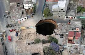 huge sinkhole swallows bus, kills six