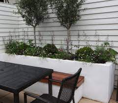 Painting bricks white is one of the easiest and most effective ways to update an interior scheme. Paint It White White Rendered Walls And White Fencing