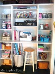 This custom craft room boasts plenty of open storage to put tools and materials within reach, plus a large work surface. Craft Organization Inspiration My Sophia Ryan Craft Closet Organization Craft Room Closet Sewing Room Organization