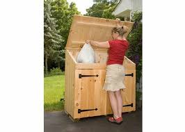 Trash Can Storage Shed Wood Garbage Can Storage The open slatting of the ipe wood and the lack of a roof ensure plenty of ventilation for the units while providing an attractive.