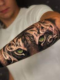 20 Cool Eye Tattoos For Vigilant Men In 2021 Tiger Eyes Tattoo Tiger Forearm Tattoo Eyes Tattoo