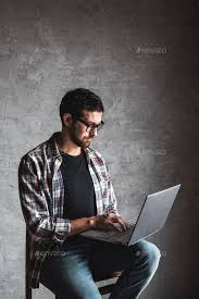 Casual Man With Laptop Over Gray Background Internet Education Work Leisure In 2020 Men Casual Gray Background Photography Poses For Men
