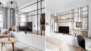 The hdtvs or monitors mount back to back on their own bracket. This Black Framed Room Divider Allows The Tv To Be Used From Both Sides