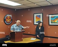 Jeff Titus speaks at a news conference after learning he will not face a  second trial after his double murder conviction was overturned in Feb.  2023. His attorney, Mary Chartier, looks on.
