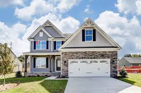 The Mcdowell 4 6 Br 3 5 Ba Carriage Style Garage Doors House In The Woods New Homes